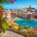 Affordable European coastal town with colorful buildings and turquoise sea